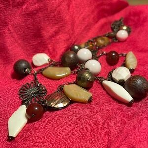 36” Necklace with Dark Gold Tones, browns, beiges and white.